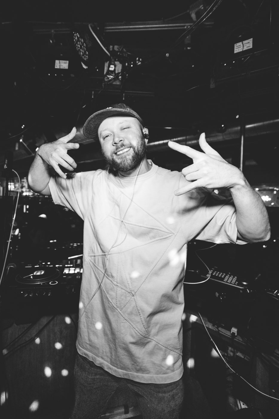 DJ Donuts in performance lighting.